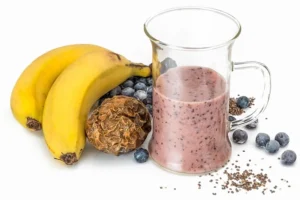 Healthy banana blueberry chia smoothie with fresh fruits and seeds, perfect for ladies fitness and nutrition