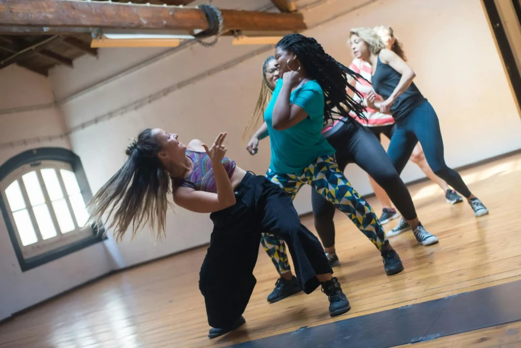 Women enjoying a high-energy dance fitness class at Herburn Studio ladies-only gym in Anchalummood, Kollam